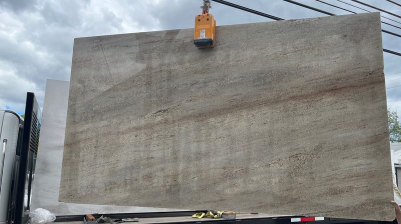 Astoria granite slab being loaded onto a truck at the stone yard