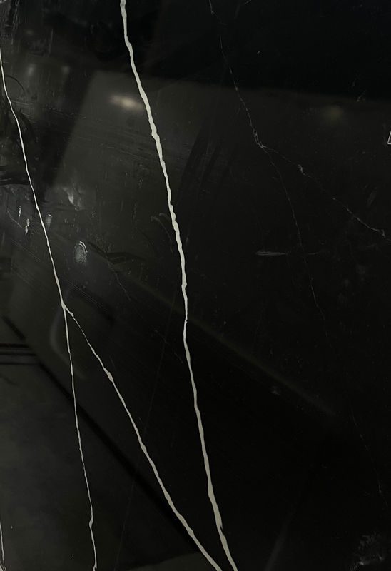 Nero Marquina quartz slab close-up, black with white veining